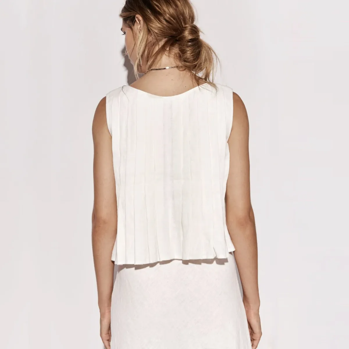 Poise Tie-Front Sleeveless Ruffle Hem Top Castello Clothing Line